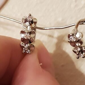 925 Sterling Silver Huggy Earrings With A Flower Motif.